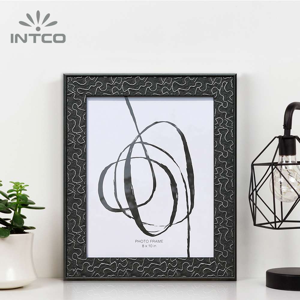 Display your cherished memories in this black classic embossed photo frame